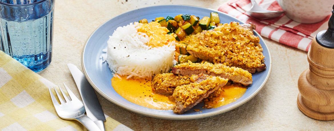 Schweinesteaks mit Erdnusskruste, fruchtiger Paprikasauce und Reis für 4 Personen von lidl-kochen.de